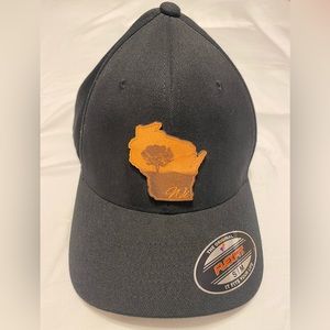 Black fitted Wisconsin emblem hat.  Never worn-brand new.